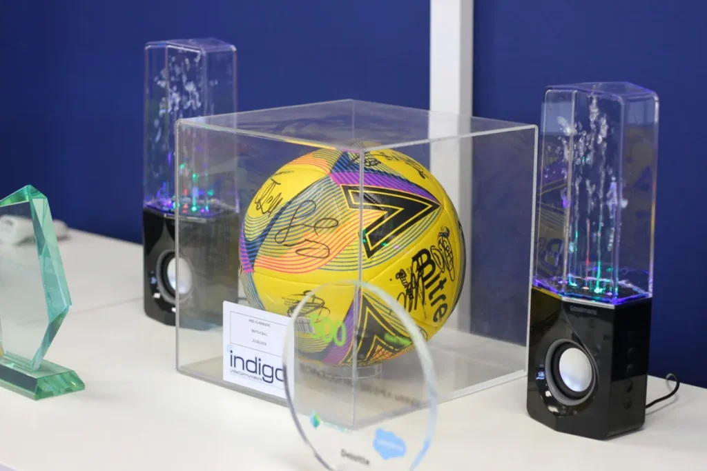 Awards and a signed football in the Indigo office