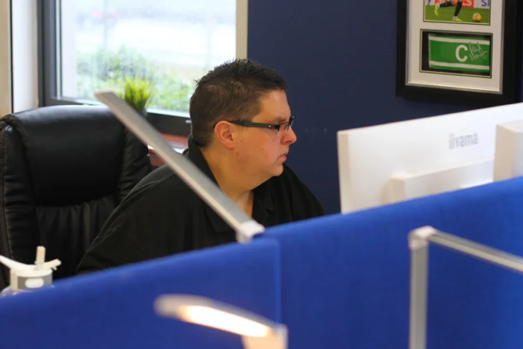 Indigo team member at his desk in the Glasgow office